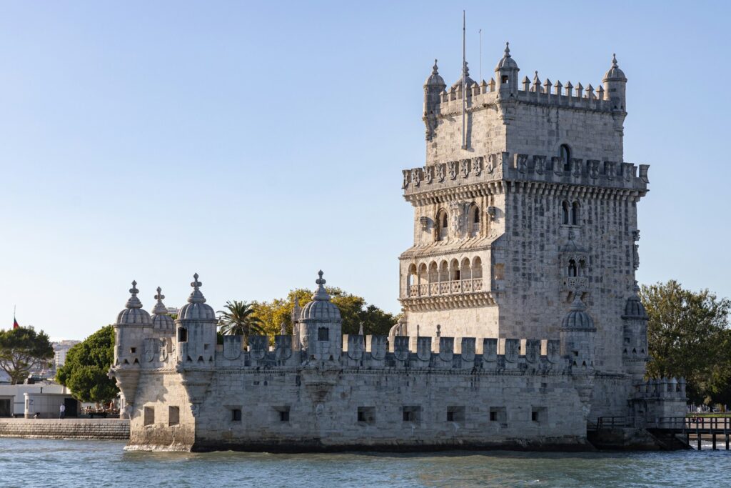 A castle like structure sitting on top of a body of water